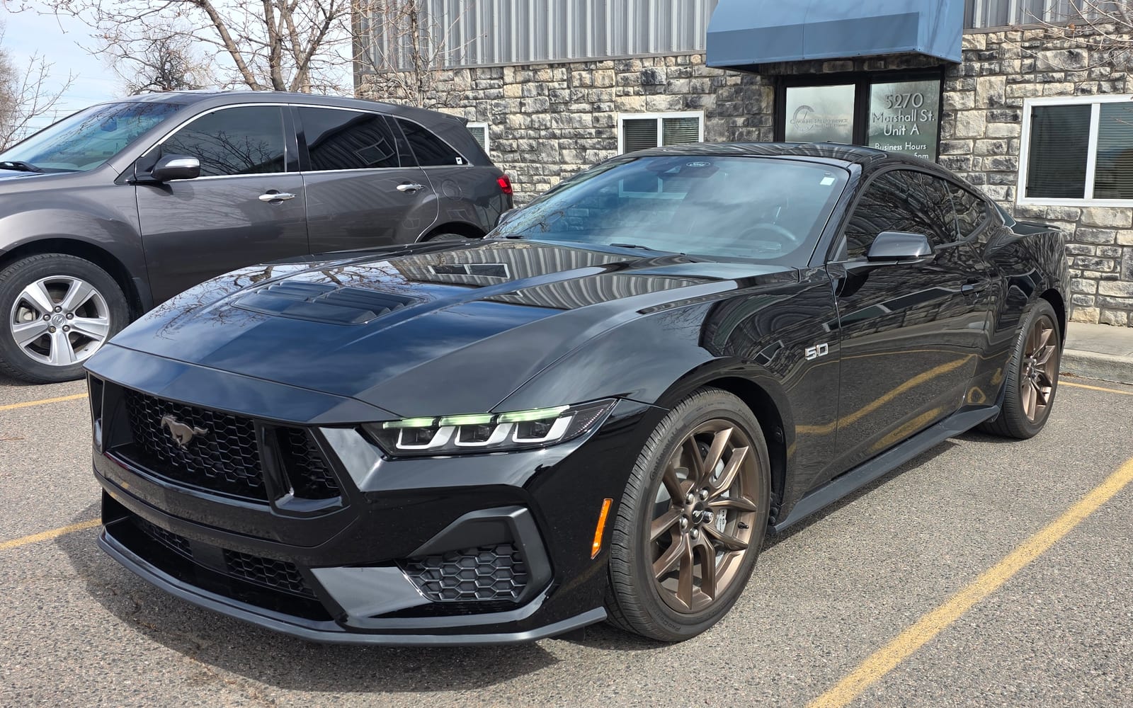 Ford Mustang GT outside the shop